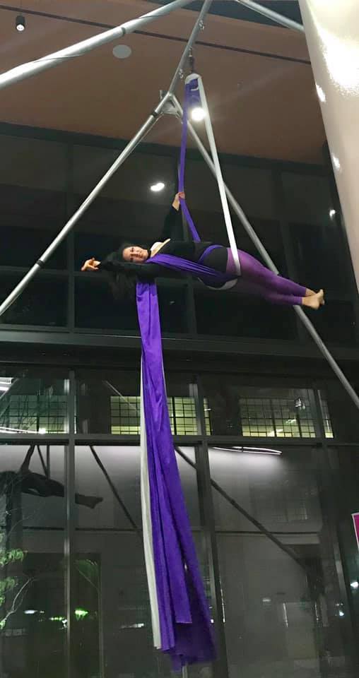 woman performs aerial silks