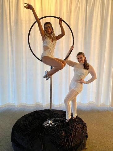 two girls aerial hoop performers